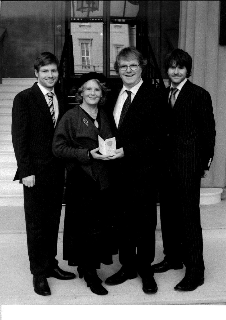 A photo of Professor Maclean and his family receiving his award