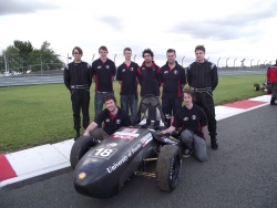 picture shows students with their car at Silverstone