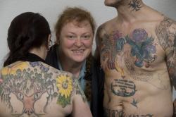 Image shows Professor Black with some of the tattooed volunteers