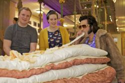 Image shows Ross and Stephanie with Elvis, who's enjoying some cheese topping on the set of 'Into the Woods'