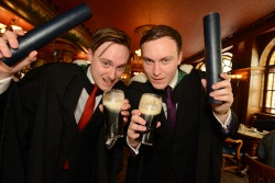 Image shows Fraser (left) and Calum celebrating their Graduation by toasting their father