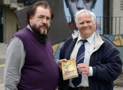picture shows author Eddie Small presenting University Rector Brian Cox with his copy of the book