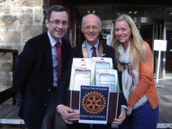 pic shows (l-r): Rev Gordon Campbell, Tim Heilbronn and Lorna Macpherson, one of the trip organisers, with the
calculators donated by Supplies Team Solutions Scotland