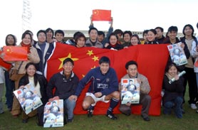 a photo of students with Fan Zhiyi at Dens Park