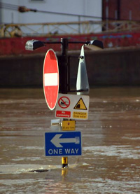 streetsign visible above flooded road