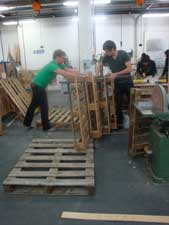 Picture shows students working on the construction of the Stak'd sitooterie