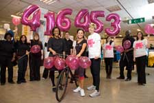 Jessie Wallace takes to the pedals with Debenhams Senior Store Manager, Nadia Ohaka, (left) and Breast Cancer Campaign's Director of Fundraising (right). (Debenhams and Breast Cancer Campaign staff behind, from left to right - Umme Rumman, Shamima Begum, Sarah Lock, Sarah Davis, Daniel Cornes, Louise Garrahan, Okath Huma, Emily Snelling, Fran Akamessan and Christina Partakides