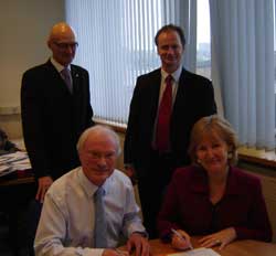Picture shows Professor Calderhead and Shirley Scott signing the Memorandum, watched by Colin Charlton (left) and Fraser Durie (right).
