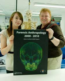 pic shows student editor Eilidh Ferguson and Professor Black with the cover of the book